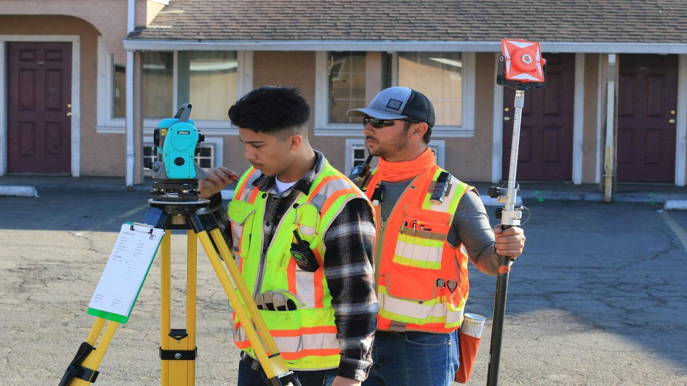 Young traveller in hi-vis gear on a building site