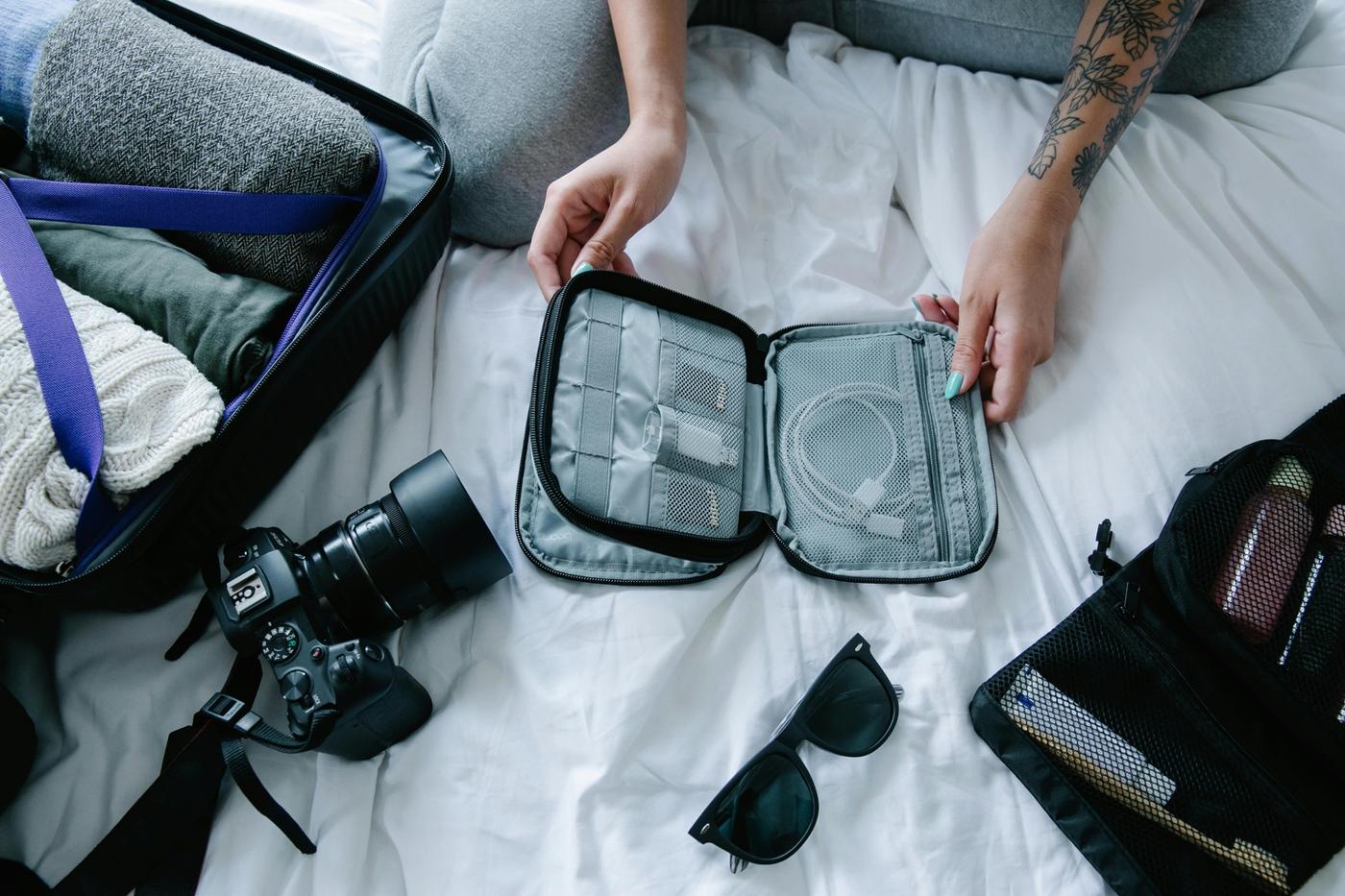 Packed backpack on hostel bed